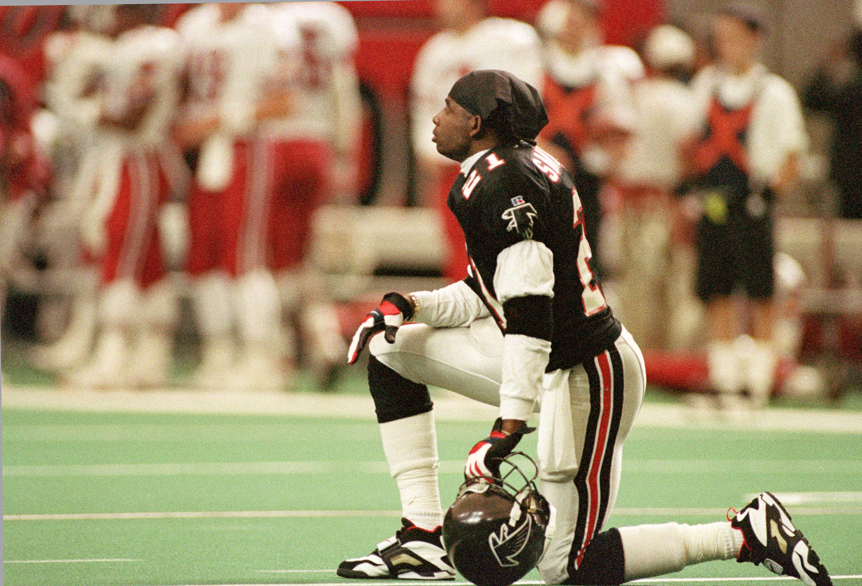 Atlanta Falcons cornerback Deion Sanders looks towards the stands from the field during a timeout against the Phoenix Cardinals in the Falcons' last game of the season at the Georgia Dome in Atlanta, Jan. 2, 1994.  (AP Photo/Ric Feld)